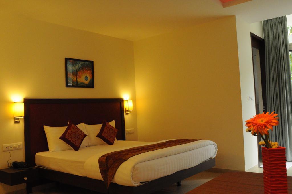 Ixora Suites Бенґалуру Номер фото